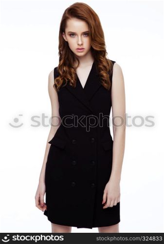 Young beautiful fashion model wearing black dress with no sleeves on white background