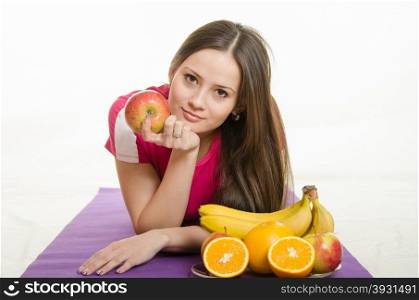 Young beautiful girl athlete Europeans conducting physical training, and promotes healthy eating