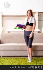 Young beautiful girl doing exercises at home 