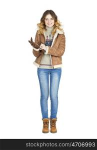 Young beautiful girl in a leather sheepskin coat and blue jeans isolated on white background