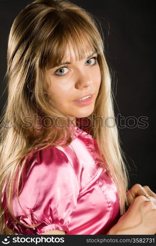 young beautiful girl in a pink blouse