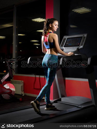 Young beautiful girl in fitness club