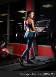Young beautiful girl in fitness club