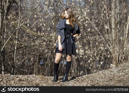 Young beautiful girl, on background spring forest