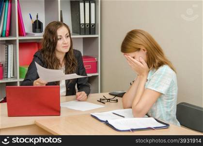 Young beautiful girl on reception at the office specialist. Office worker punished crying head office