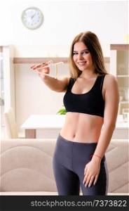 Young beautiful girl with calipers in dieting concept