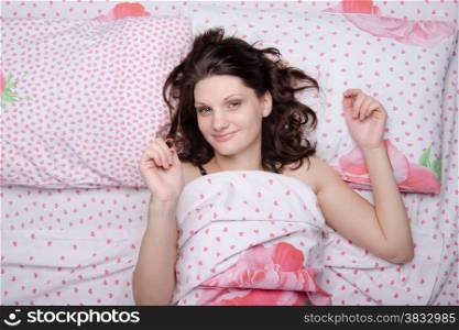 Young beautiful girl woke up alone in bed