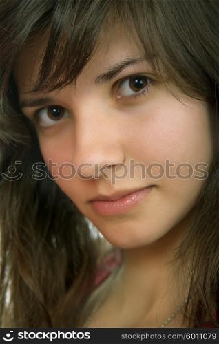 young beautiful pensive woman close up portrait