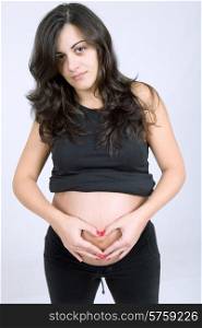 young beautiful pregnant woman, studio picture