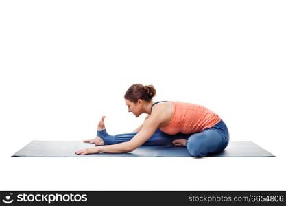 Young beautiful sporty fit woman doing Ashtanga Vinyasa Yoga asana Janu sirsasana A - head-to-knee pose A easy posture variation isolated on white. Woman doing Ashtanga Vinyasa Yoga asana Janu sirsasana