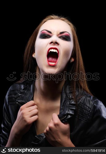 Young beautiful vampire woman on black