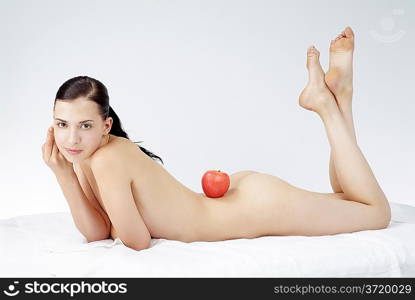 Young beautiful woman and apple
