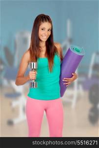 Young beautiful woman at the gym ready for sports