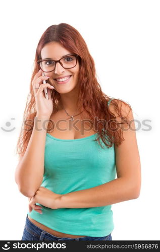 Young beautiful woman at the phone, isolated over a white background