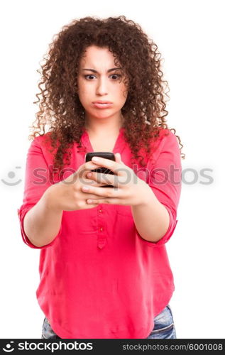 Young beautiful woman at the phone, isolated over a white background