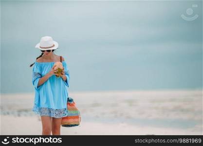 Young beautiful woman at white sand tropical beach. Young beautiful woman on the beach vacation