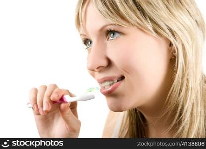 Young beautiful woman brush her teeth