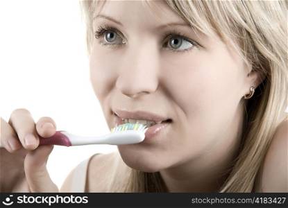 Young beautiful woman clean her teeth