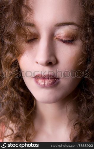 young beautiful woman close up portrait with closed eyes
