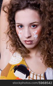 young beautiful woman close up portrait with painted face