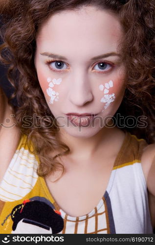 young beautiful woman close up portrait with painted face