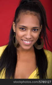 young beautiful woman closeup portrait, on a red background