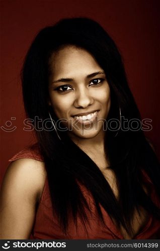 young beautiful woman closeup portrait, on a red background