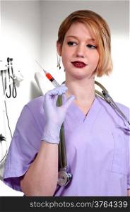 Young beautiful woman doctor with a medical syringe with medicine