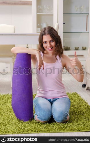 Young beautiful woman doing exercises at home 