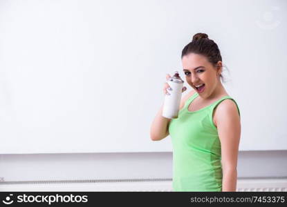 Young beautiful woman doing renovation at home 