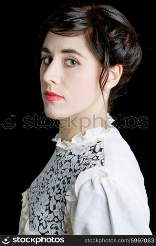 young beautiful woman dressed as bride on a black background