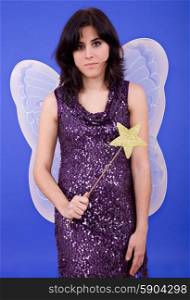 young beautiful woman dressed as tinkerbell, studio picture