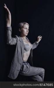 Young beautiful woman dressed in gray suit