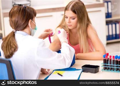 Young beautiful woman during blood test procedure. Young beautiful woman during blood test sampling procedure 