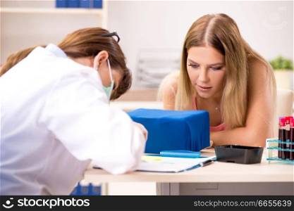 Young beautiful woman during blood test sampling procedure  . Young beautiful woman during blood test sampling procedure 