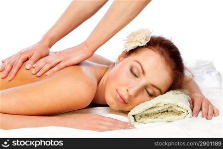 Young beautiful woman getting massage. Isolated over white.