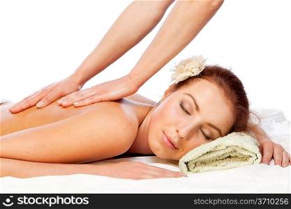 Young beautiful woman getting massage. Isolated over white.