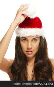 young beautiful woman holding tip of santas hat. young beautiful christmas woman holding tip of santas hat on white background
