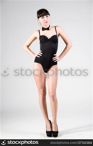 young beautiful woman in a black bodysuit