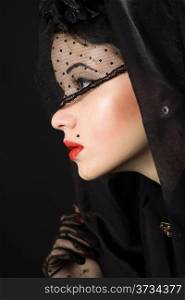 young beautiful woman in a black veil