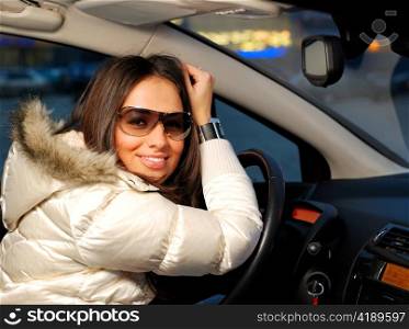 young beautiful woman in a car
