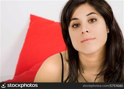 young beautiful woman in bed, studio picture