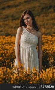 Young beautiful woman in nature with a pensative expression