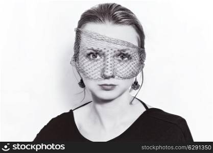 Young beautiful woman in the veil on a white background
