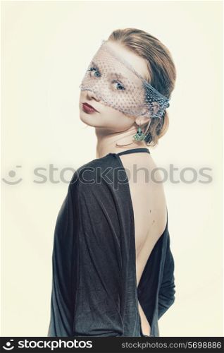 Young beautiful woman in the veil on a white background closeup