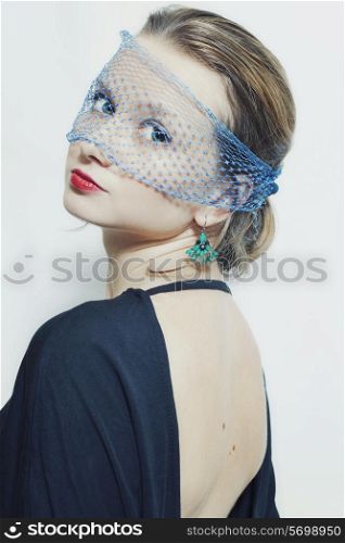 Young beautiful woman in the veil on a white background closeup. Retro style&#xA;