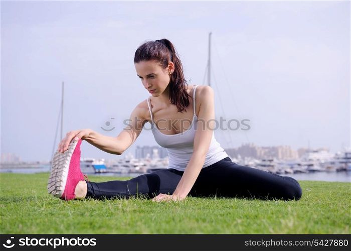 Young beautiful woman jogging and running on morning at park in the city. Woman in sport outdoors health and fitness concept