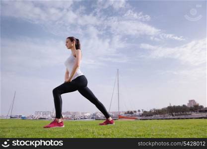 Young beautiful woman jogging and running on morning at park in the city. Woman in sport outdoors health and fitness concept