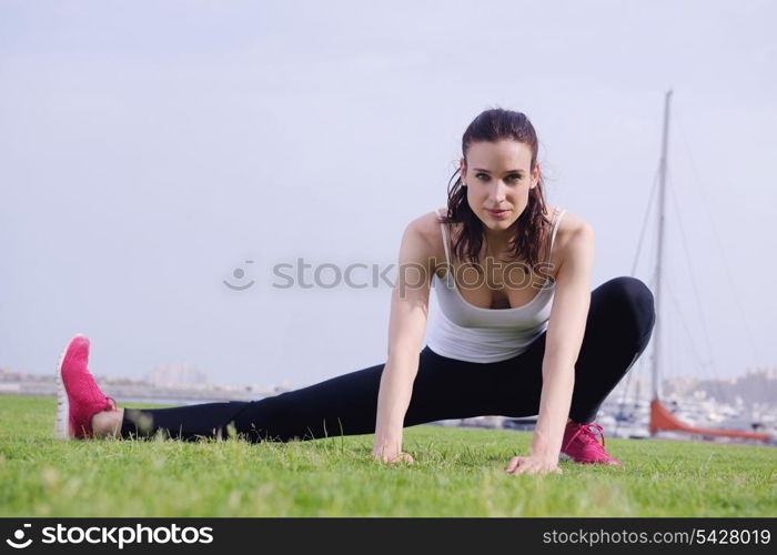 Young beautiful woman jogging and running on morning at park in the city. Woman in sport outdoors health and fitness concept