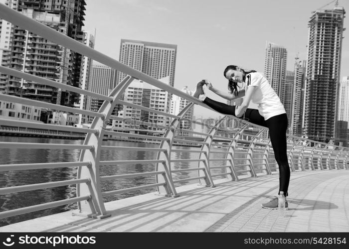 Young beautiful woman jogging and running on morning at park in the city. Woman in sport outdoors health and fitness concept